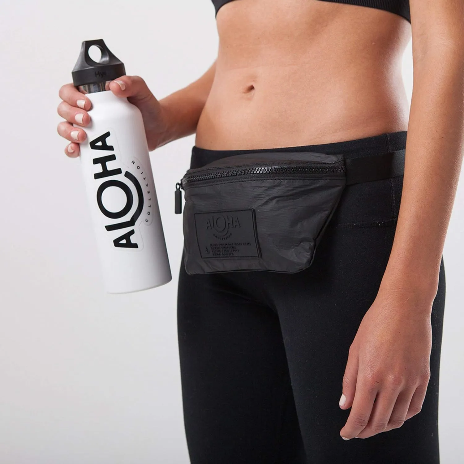 ALOHA Collection Black Mini Hip Pack, Lightweight, Packable, & Splash-Proof - Durable, Washable, & Reusable Fanny Pack for Gym, Beach & Travel, Easy to Clean Material (8.5" x 3.75")